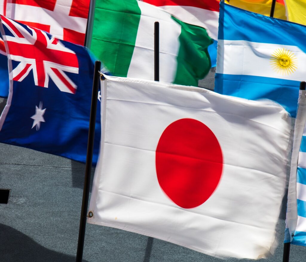 The Japanese flag in the foreground of other flag