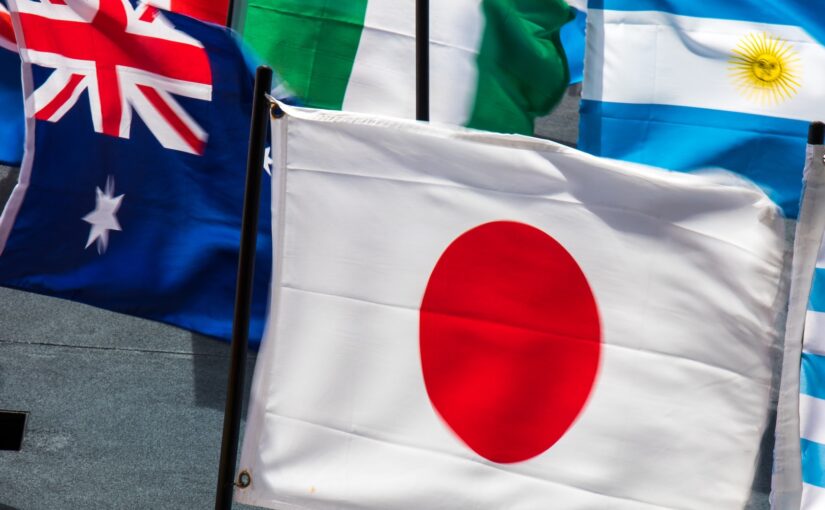 The Japanese flag in the foreground of other flag
