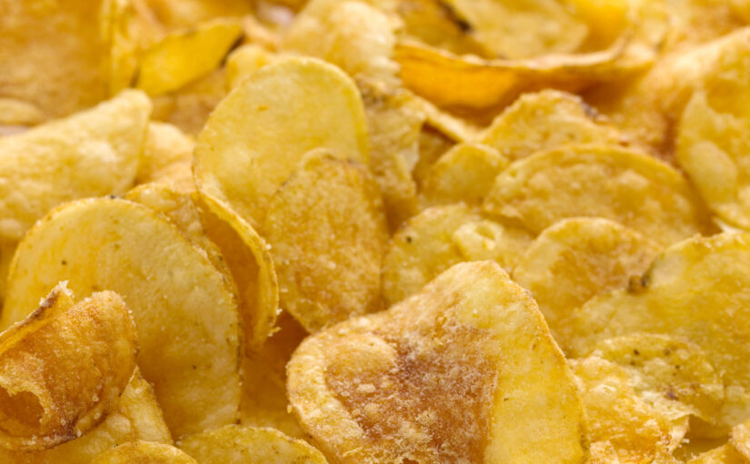 Close up freshly fried potato chips