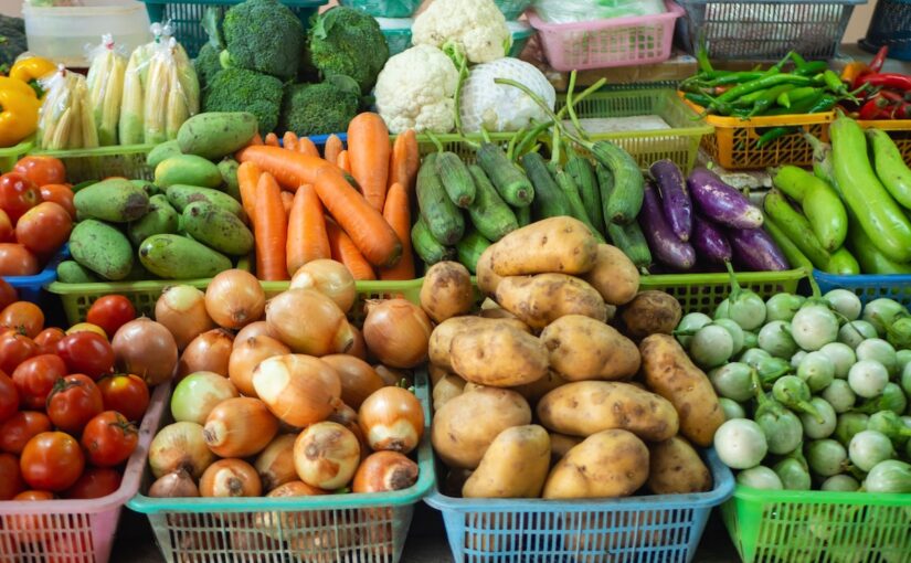 Baskets of carrots, onions, potatoes and other vegetables