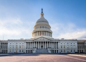 The U.S. Capitol building against a clear blue sky