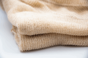 A closeup of fiber formed into a sweater
