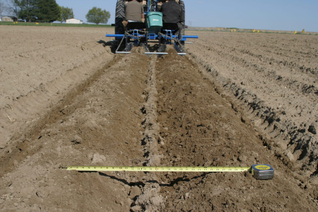 Reduced row width for increased yield