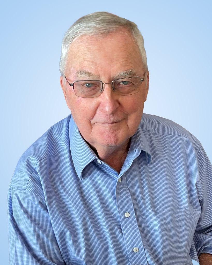 A smiling man in a blue shirt 