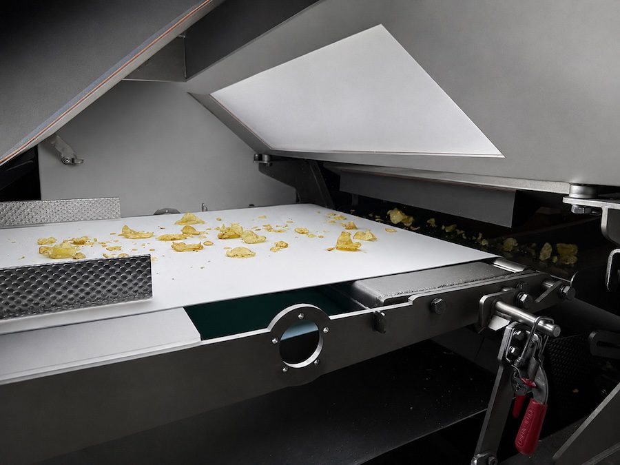 A large sorter scans potato chips